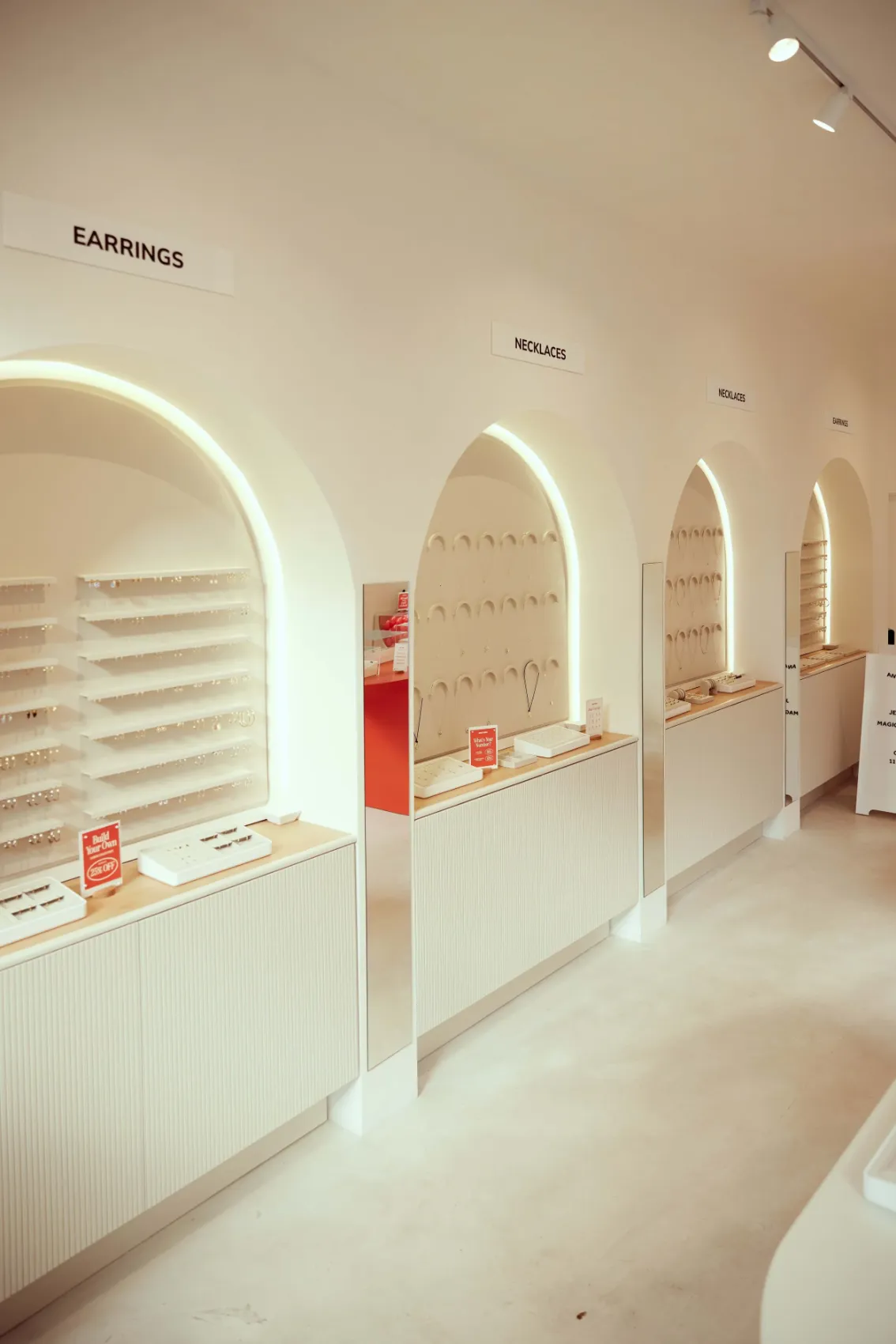 Arched, softly lit earring displays