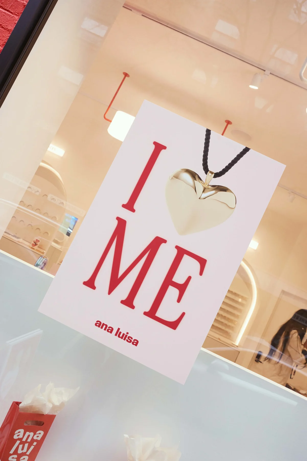 “I ♥ Me” poster in the store window