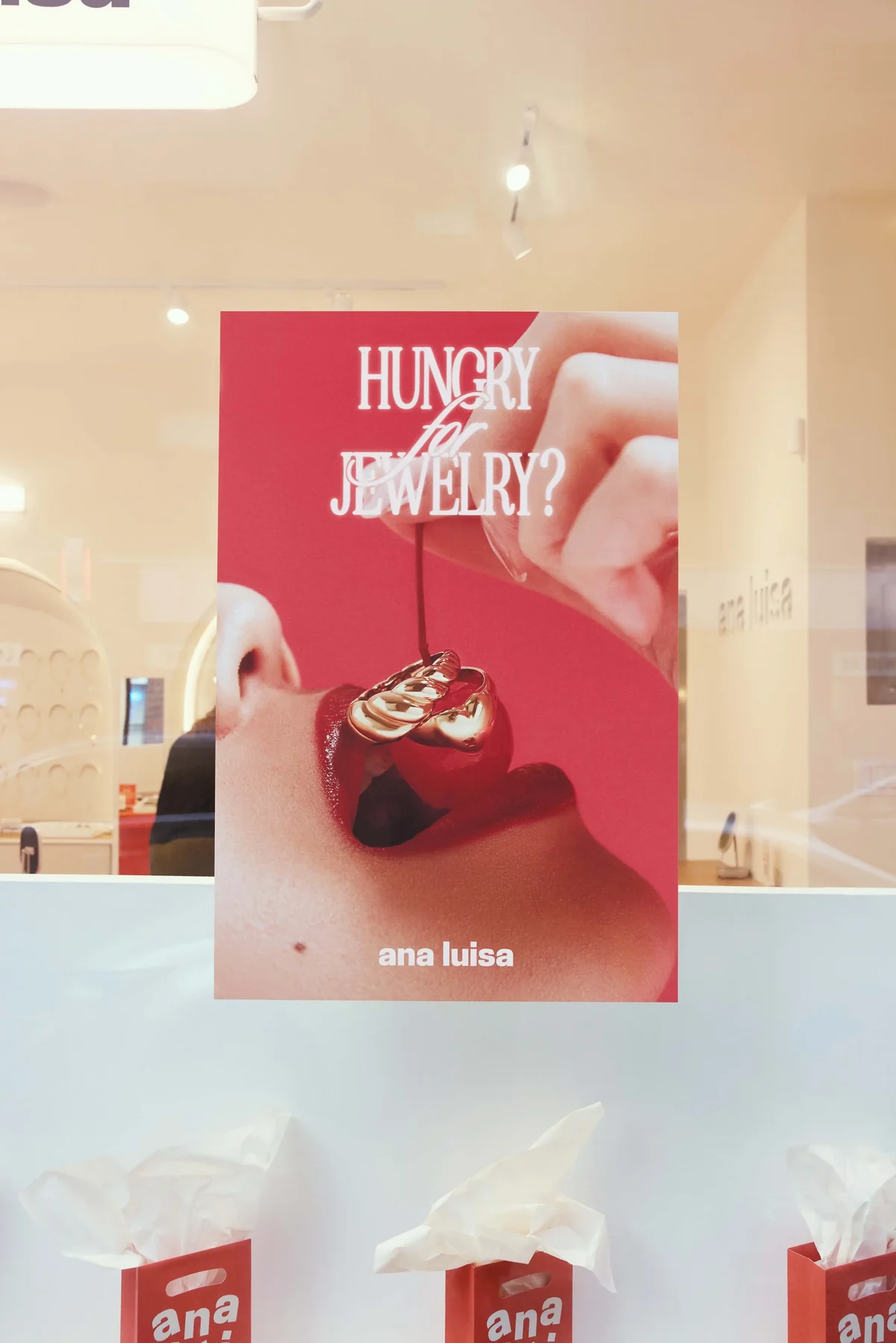 “Hungry for jewelry?” poster with a cherry and gold ring